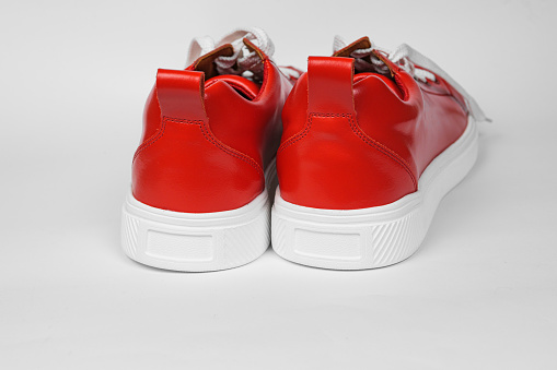 Red leather sneakers with white soles and white laces-5