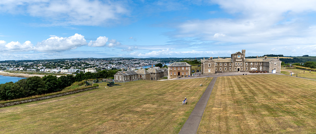 Pendennis Castle, Falmouth, Cornwall, UK - July 5, 2023. Panorama landscape of the military barracks at Pendennis Castle in Cornwall with Falmouth in the backsground