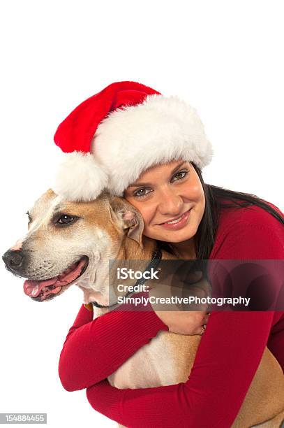 Hugging Dog At Christmas Stock Photo - Download Image Now - Adult, Adults Only, Affectionate