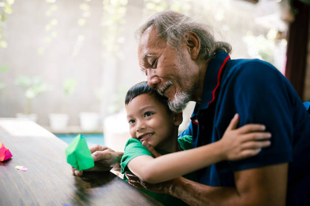 Asian grandfather and grandson having moment together. Seniors with grandkids