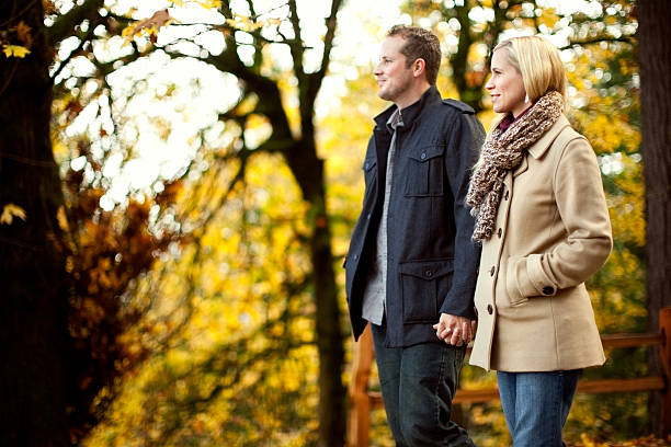 istock Young Couple And Autumn Leaves 154885336