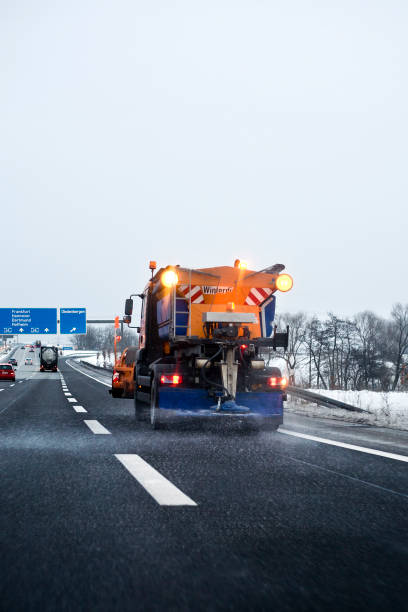 istock Winter service in action - laying road salt on autobahn 154887517