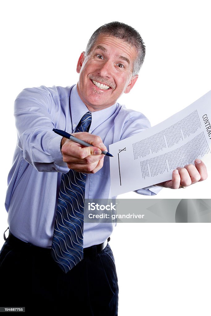 Pushy Salesman with Contract Isolated on White Smiling man with a cheesy grin gesturing for you to sign a contract, isolated on white. Man is mid 40s caucasian, has a mustache and short grey hair and is wearing a blue long sleeve shirt and dark blue tie. He is portraying a role as a used car salesman or some other type of high pressure sales. Salesman Stock Photo