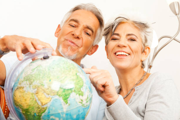 senior couple planning a world tour