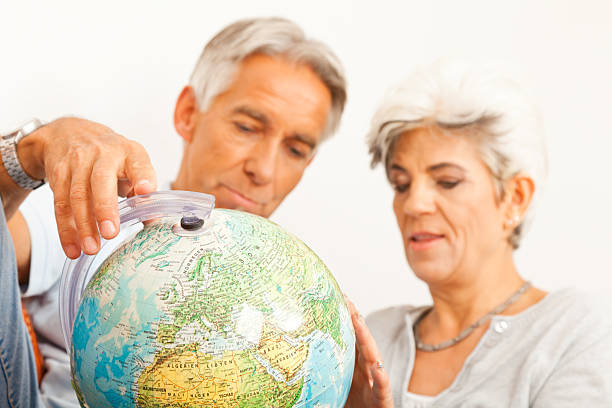 istock senior couple planning a world tour 154887767