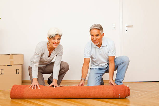 istock senior couple moving into a new apartment 154887776