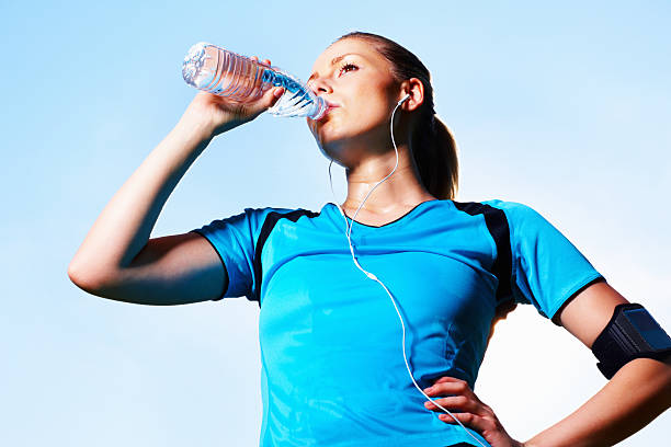 istock Woman drinking cool water after a long run 154887829