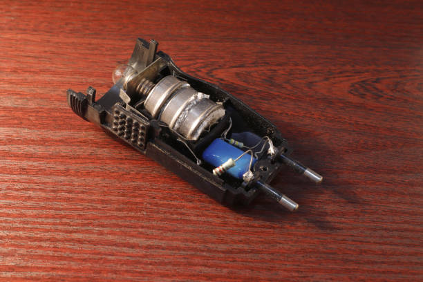 istock Image of an opened flashlight with old round batteries covered with oxides. 1548888382