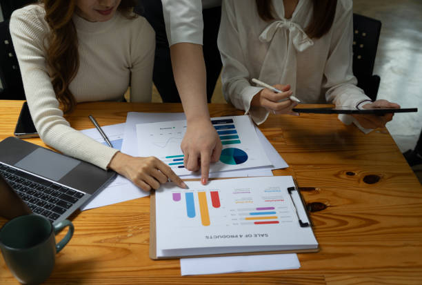 istock Young business team working with business report documents on office desk. Brainstorming Business People Design Planning, Brainstorming Planning Partnership. 1548892716