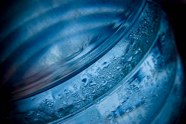 Bottle of pure water in the splash with lemon slices
