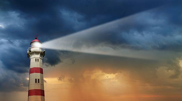 White lighthouse in stormy weather on the cliff, photomontage.