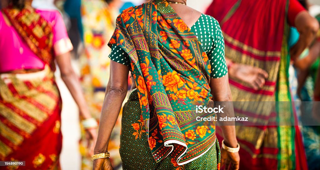 Women in India Indian Women dressed in colorful saris at the Taj Mahalhttp://refer.istockphoto.com/traffic_record.php?lc=056905042431004653&atid=6683%7CBannerID%3D6683%7CReferralMethod%3DLink Sari Stock Photo