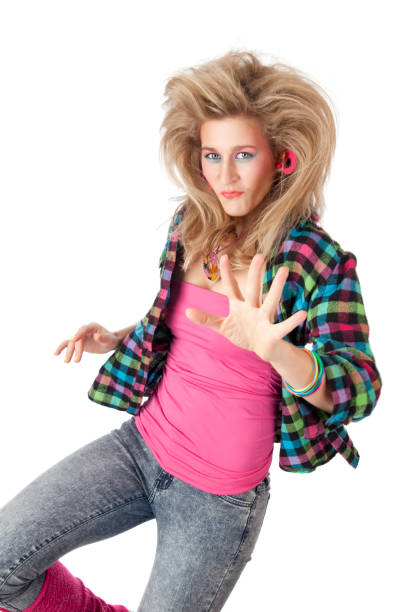 Retro revival: young blond woman with 80s hairstyle and makeup