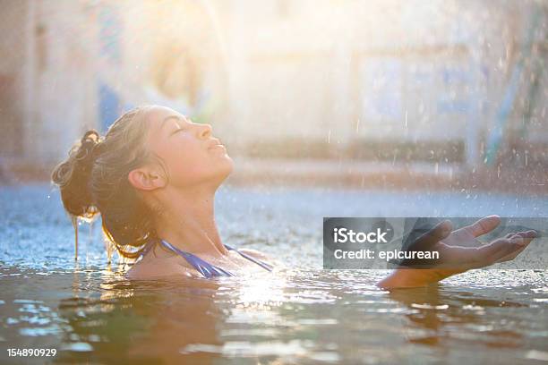 Young Beautiful Woman Swimming In The Rain Stock Photo - Download Image Now - Lake, Rain, Swimming Pool