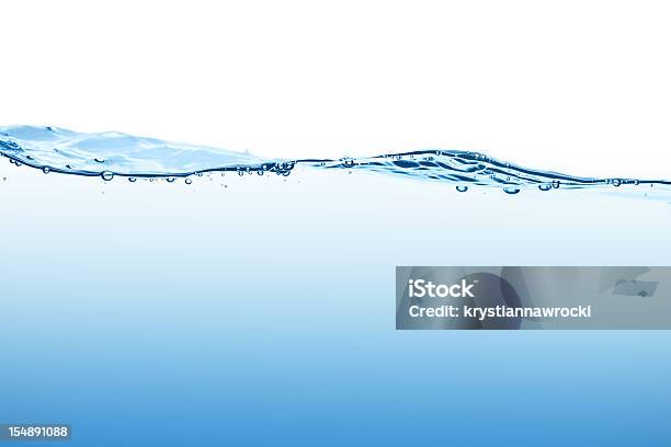 Calm Blue Water Surface With Bubbles Seen At Low Angle Stock Photo - Download Image Now