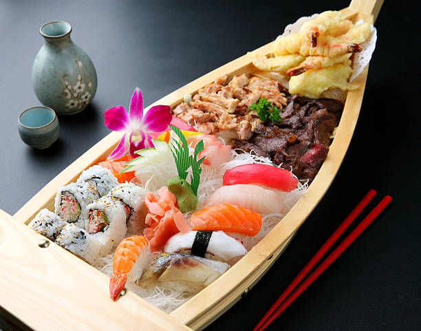 Sushi Boat Sushi Boat - Teriyaki, California Roll, Sushi & tempura japanese cuisine food rolled up japanese culture stock pictures, royalty-free photos & images