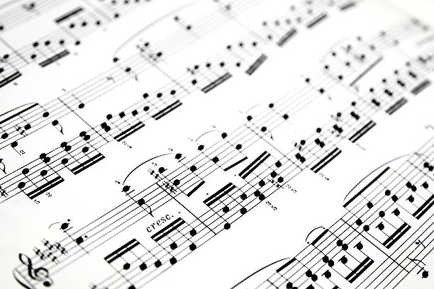 Close-up of sheet music background Close up shot of musical notes on sheet music musical stave stock pictures, royalty-free photos & images