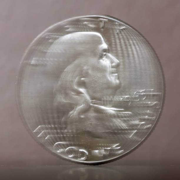 istock Spinning coin frozen in motion 1548912271