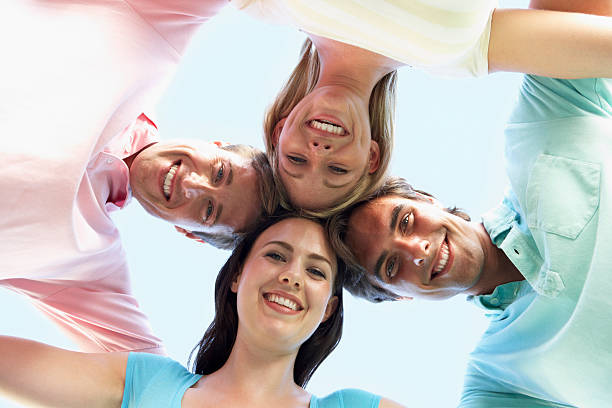 istock Group Of Friends Looking Down Into Camera 154891354