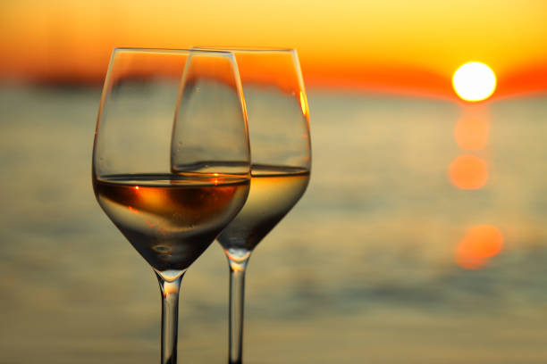 istock Two glasses of wine and beautiful sunset 154891366