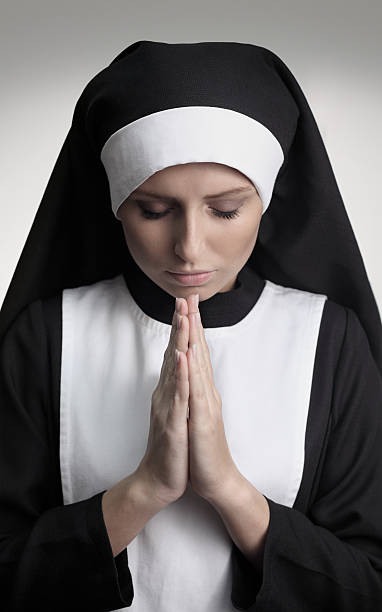 信仰 - nun catholicism praying women ストックフォトと画像
