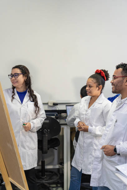istock researchers discussing a project standing in front of a whiteboard with marker pen 1548914444
