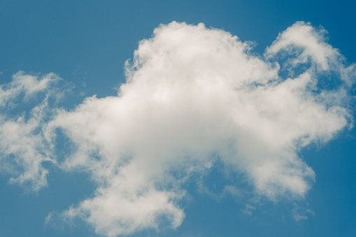 Beautiful blue sky and white fluffy cloud background