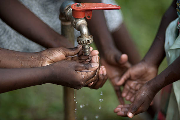 istock Hands of a african child under tab 154891687