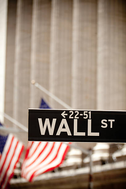 istock Wall street sign and American flags 154891702