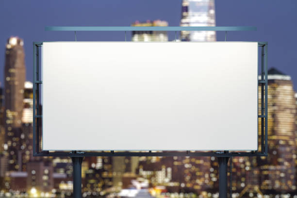 istock Blank white horizontal billboard on skyline background at evening, front view. Mock up, advertising concept 1548927980