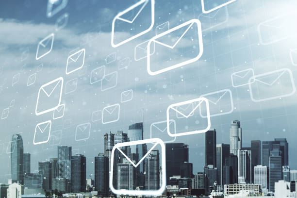 istock Abstract virtual postal envelopes illustration on Los Angeles skyline background. Email and communications concept. Multiexposure 1548930614