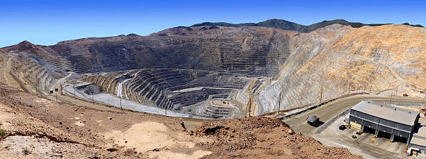 Open Pit Panorama Very large panorama of the Bingham Canyon Kennecott  copper mine in Utah.  It is one of the largest open pit mines in the world and can be seen from orbit. open pit mine stock pictures, royalty-free photos & images