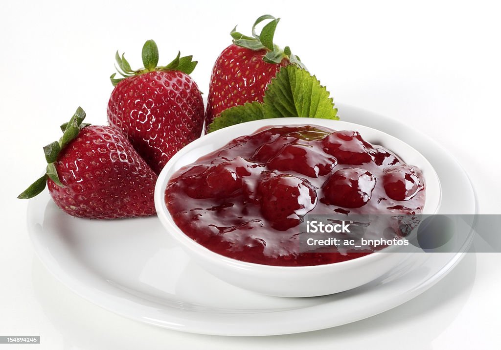 Strawberry jam with fresh strawberries Homemade strawberry jam in a bowl and fresh strawberries Strawberry Jam Stock Photo