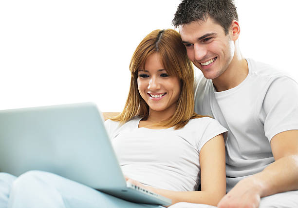 istock Smiling couple are  working together on laptop. 154894294