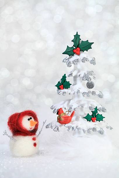Snowgirl and Christmas tree stock photo