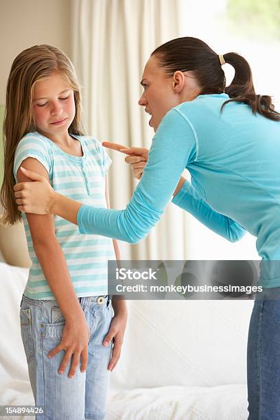 Mother Telling Off Daughter At Home Stock Photo - Download Image Now - 10-11 Years, Anger, Arguing