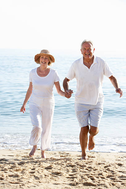 istock Senior Couple Enjoying Beach Holiday 154894447
