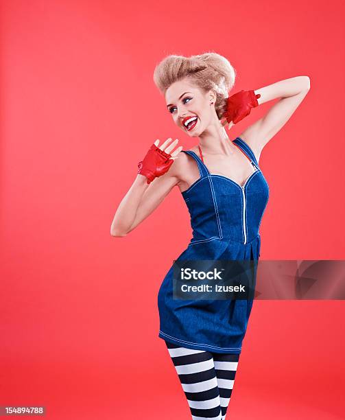 Fashion Portrait Of Woman Posing Against Red Background Stock Photo - Download Image Now