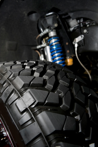 Close up of a small monster truck suspension.