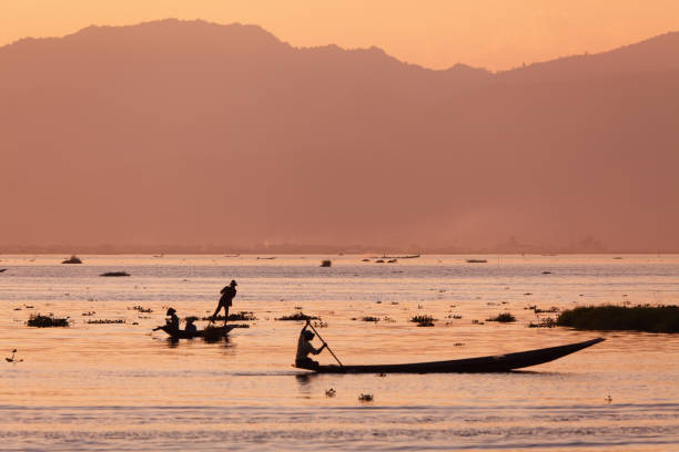 istock sunset and fishermen 154894971