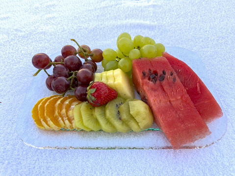 A plate of fresh summer fruits