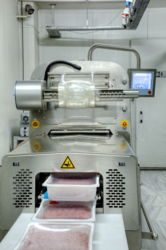Food (ground beef) vacuum and packing machine. +4 degrees celcius cold room.
