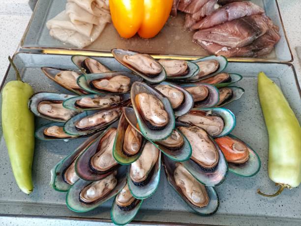 Fresh food A plate of fresh Mussels in the buffet seafood salad stock pictures, royalty-free photos & images