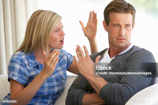 Young Couple Having Argument At Home Stock Photo - Download Image Now - Arguing, Couple - Relationship, Shouting