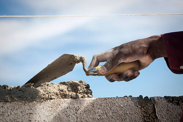 Black hand with trowel stock photo