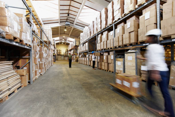 istock Long stack arrangement of goods in a wholesale warehouse depot 154904911