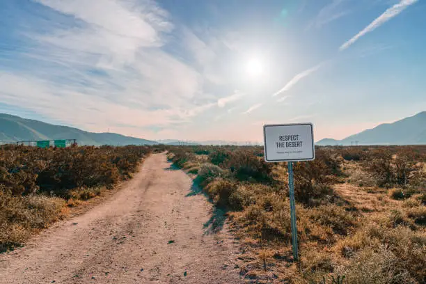 Respect the desert. Please stay on the path sign. Located on a dirt road in the area of Cabazon and Palm Springs, California.
