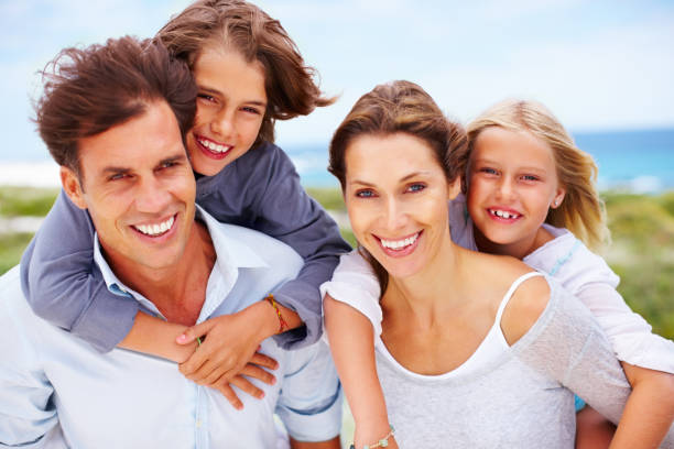 istock Happy family with ocean in background 154905295