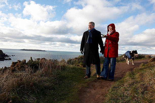 istock Mature couple enjoying winter walk on coastal path 154905466
