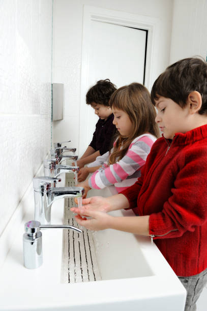 istock Kids washing hands in bathroom 154905544
